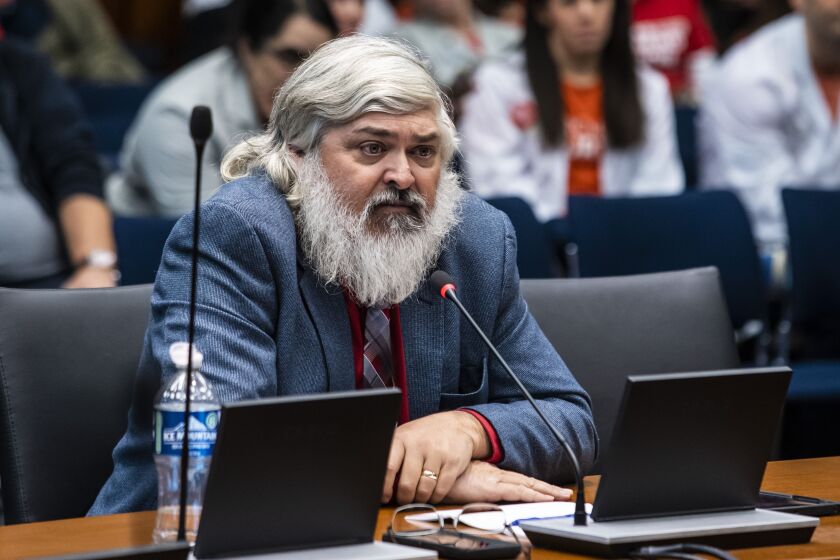 Todd Vandermyde, retired lobbyist for the National Rifle Association, testifies on Dec. 20 against the state’s proposed assault weapons ban during a meeting of the Illinois House Judiciary Criminal Committee at the Bilandic Building in the Loop.