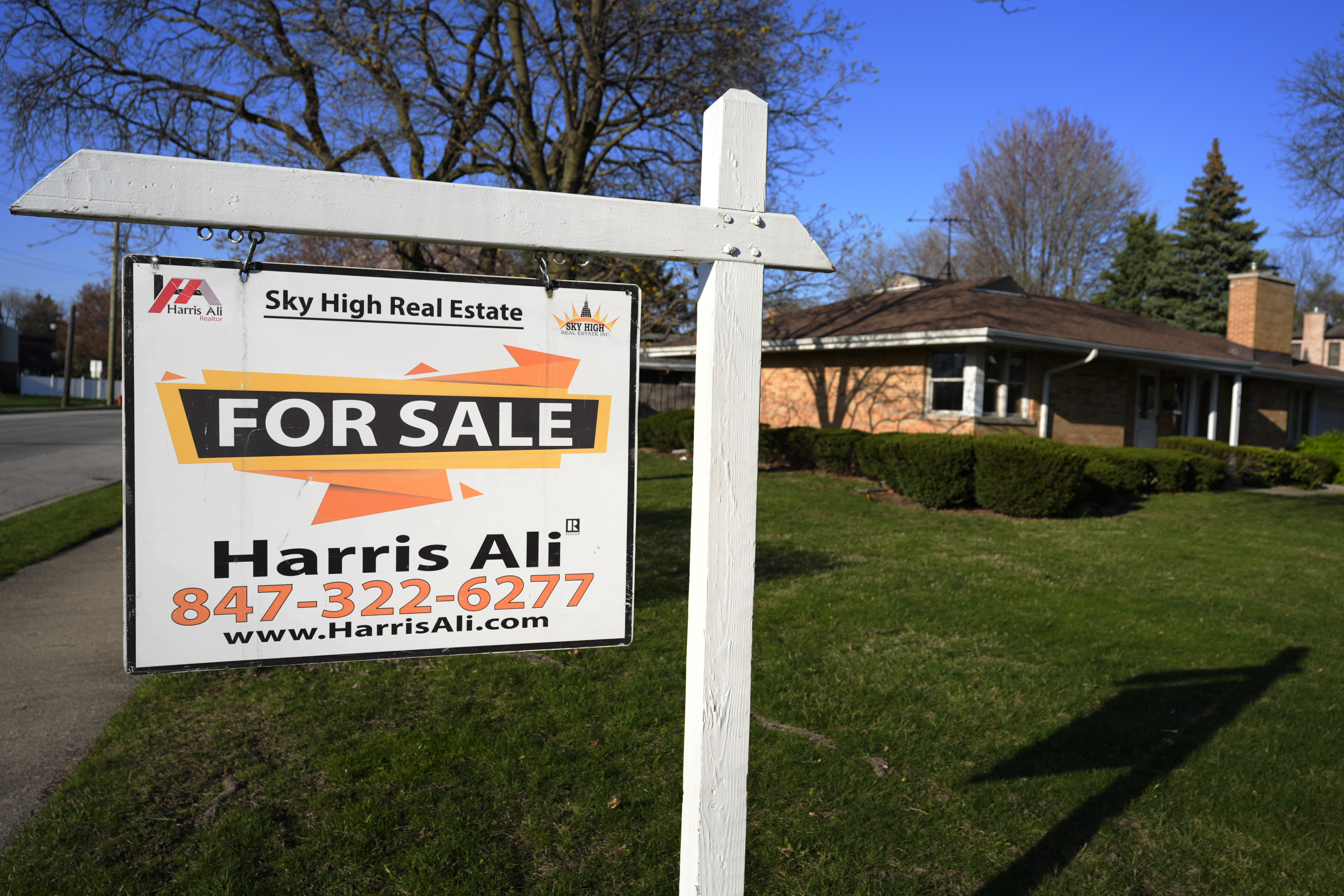 A "For Sale" sign is displayed in front of a home in Skokie.