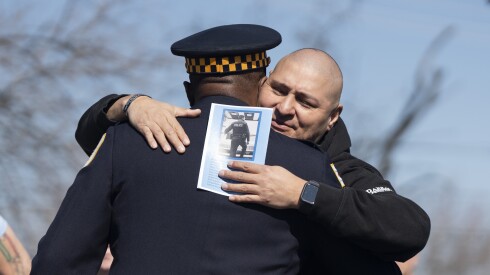Chicago police Supt. Larry Snelling hugs Carlos Yanez, the former partner of slain officer Ella French, at West Marquette Road and South Lawndale Avenue in West Lawn, where officials and family members unveiled a street sign named in honor of Chicago police officer Andrés Mauricio Vásquez Lasso, Saturday, March 2, 2024. Vásquez Lasso was killed in the line of duty on March 1, 2023 allegedly by Steven Montano, who pleaded not guilty, in the 5200 block of South Spaulding Avenue while Vasquez-Lasso responded to a domestic violence call.
