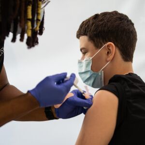 Christian Clettenberg, 15, receives a COVID-19 vaccine at the Rush University Medical Center in the Illinois Medical District in May.