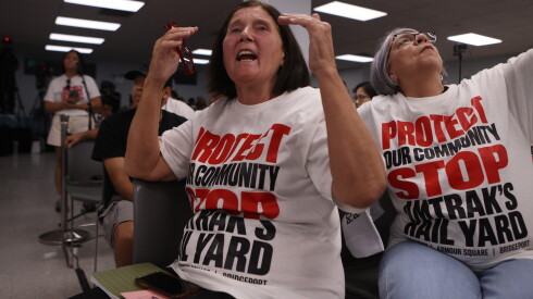 Residents react during a public meeting with Amtrak officials on Thursday.