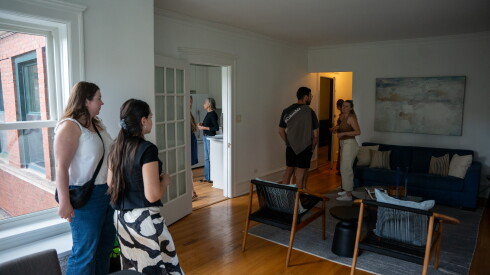Prospective homebuyers attend the open house for a one-bedroom, one-bathroom condo in Lake View listed at $329,900.