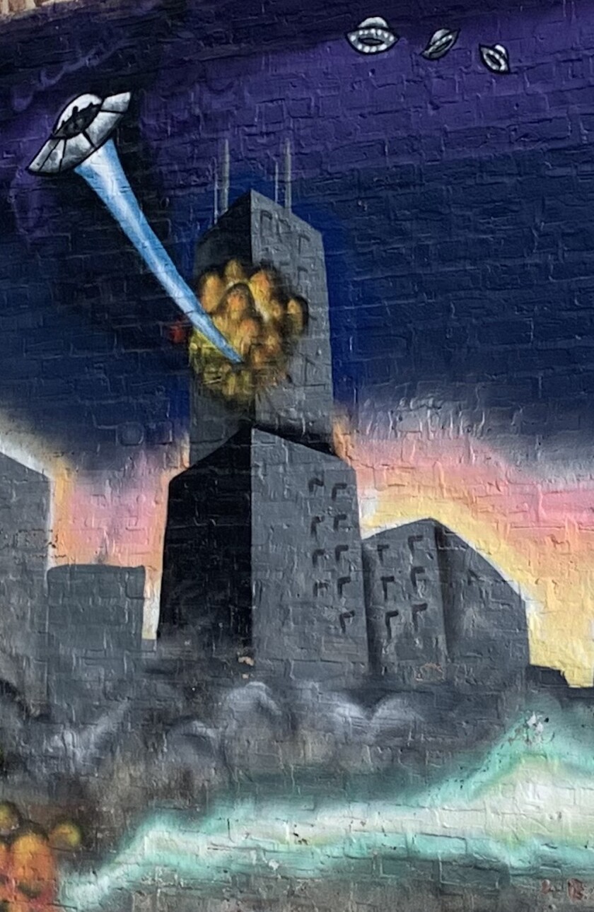 A spaceship attacks the Willis Tower in this mural at 2135 S. Western Ave.