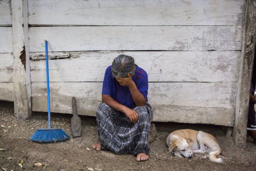 Elvira Choc, 59, Jakelin Amei Rosmery Caal’s grandmother, rests her head on her hand in front of her house in Raxruha, Guatemala, on Saturday, Dec. 15, 2018. The 7-year old girl died in a Texas hospital, two days after being taken into custody by border p