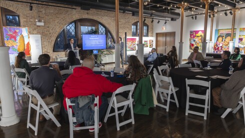 Leaders of Chicago cultural organizations listen to a presentation at the National Museum of Puerto Rican Arts and Culture on Friday.