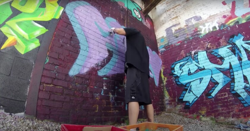 The Chicago graffiti artist who goes by Werm is shown painting inside the Damen Silos.