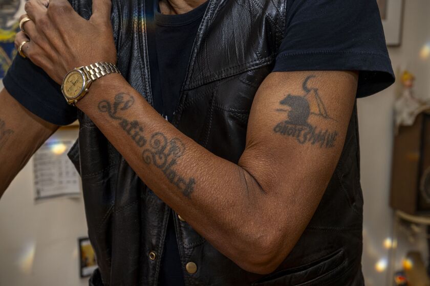 Bradley Parker-Sparrow, a professional musician and producer for 50 years, shows off his ‘Latin Black’ and ‘Desert Rat’ tattoos in his Lake View home. The tattoos represent his albums named ‘Latin Black’ released in 1979 and ‘The Desert Rat’ released in 1991.