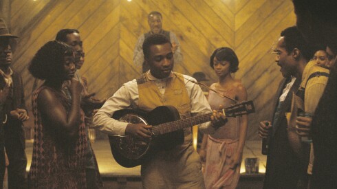 This image released by Warner Bros Pictures shows Miles Caton, center, in a scene from "Sinners." (Warner Bros. Pictures via AP)