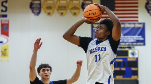 Warren’s Braylon Walker (11) shoots the ball during basketball practice.