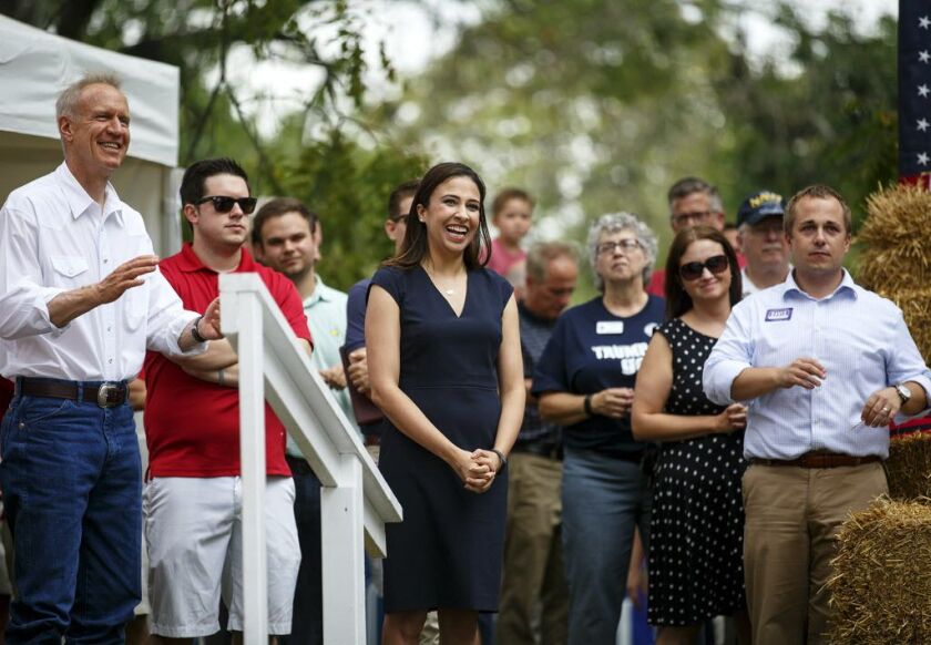 Erika Harold, center, a candidate for Illinois Attorney General, is introduced at the Governor’s Day rally at the Illinois State Fair in Springfield, Ill. Wednesday, Aug. 16, 2017. Illinois Gov. Bruce Rauner is at left. | Rich Saal/The State Journal-Regis