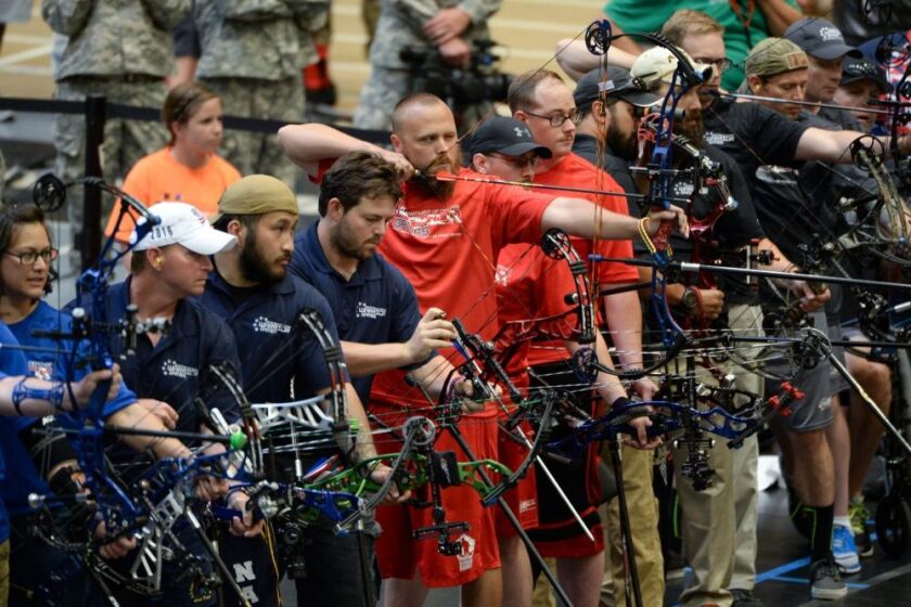 Marine Corps veteran Clayton McDaniel aims his bow in a line of archers competing in last year’s Department of Defense Warrior Games at the U.S. Military Academy in West Point, N.Y. on June 17, 2016. | Roger Wollenberg / Defense Department