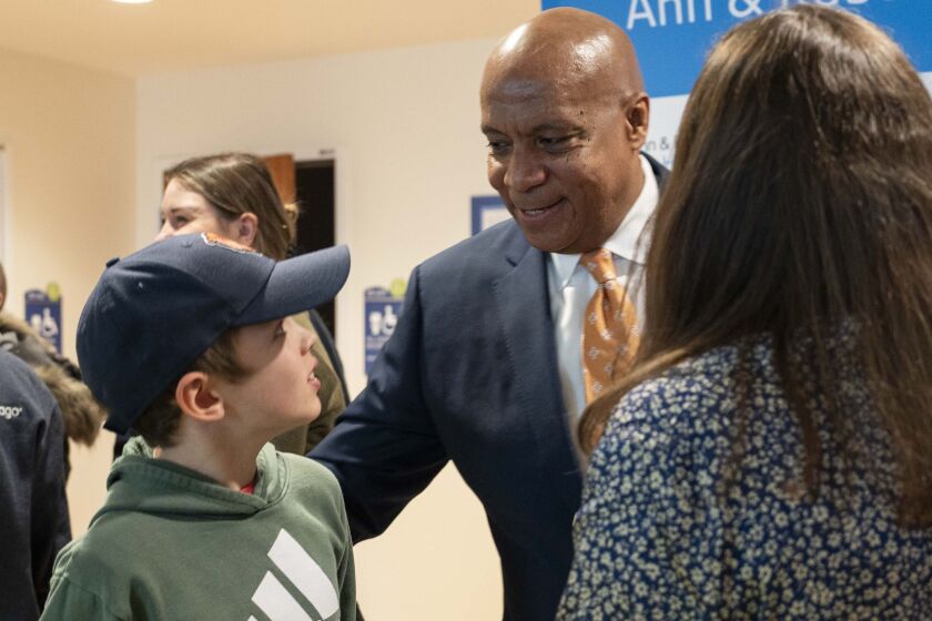 Chicago Bears President Kevin Warren speaks to Toby Wells, 10, who’s being treated for rhabdomyosarcoma at Ann and Robert H. Lurie Children’s Hospital of Chicago.