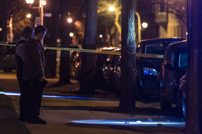 Officers respond to a shooting Tuesday night in the Old Town neighborhood that left two men critically wounded. | Tyler LaRiviere/Sun-Times
