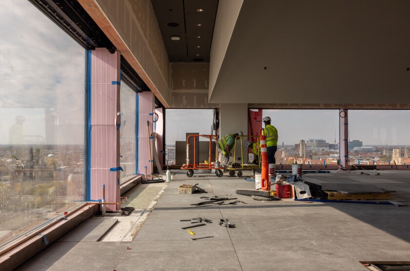 Workers build the interior of the Nelson Mandela Skyroom on the eighth floor of the Obama Presidential Center.