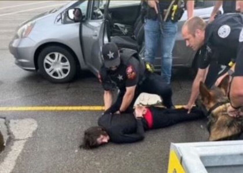 The suspected shooter is taken into custody in the northern suburbs Monday.
