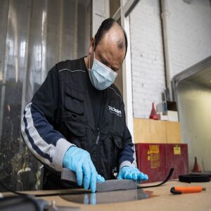 Rene Ramirez, a cabinet maker at Pac Team, makes face shields at the factory at 4447 W. Armitage Ave. on the Northwest Side, Tuesday afternoon, March 31, 2020.