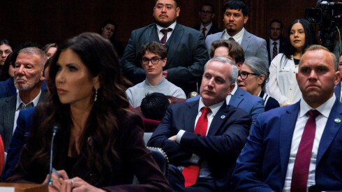 Javier Ramirez and Leonardo Garcia Venegas, U.S. citizens who were detained by ICE, and Marimar Martinez, a U.S. citizen who was shot five times by U.S. Border Patrol in Chicago, stand as U.S. Secretary of Homeland Security Kristi Noem testifies before the Senate Judiciary Committee in Washington, DC.
