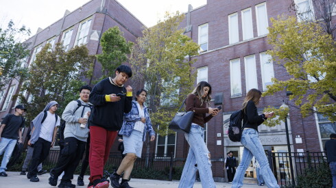Students walk out after dismissal Thursday at Thomas Kelly College Preparatory High School in Brighton Park.