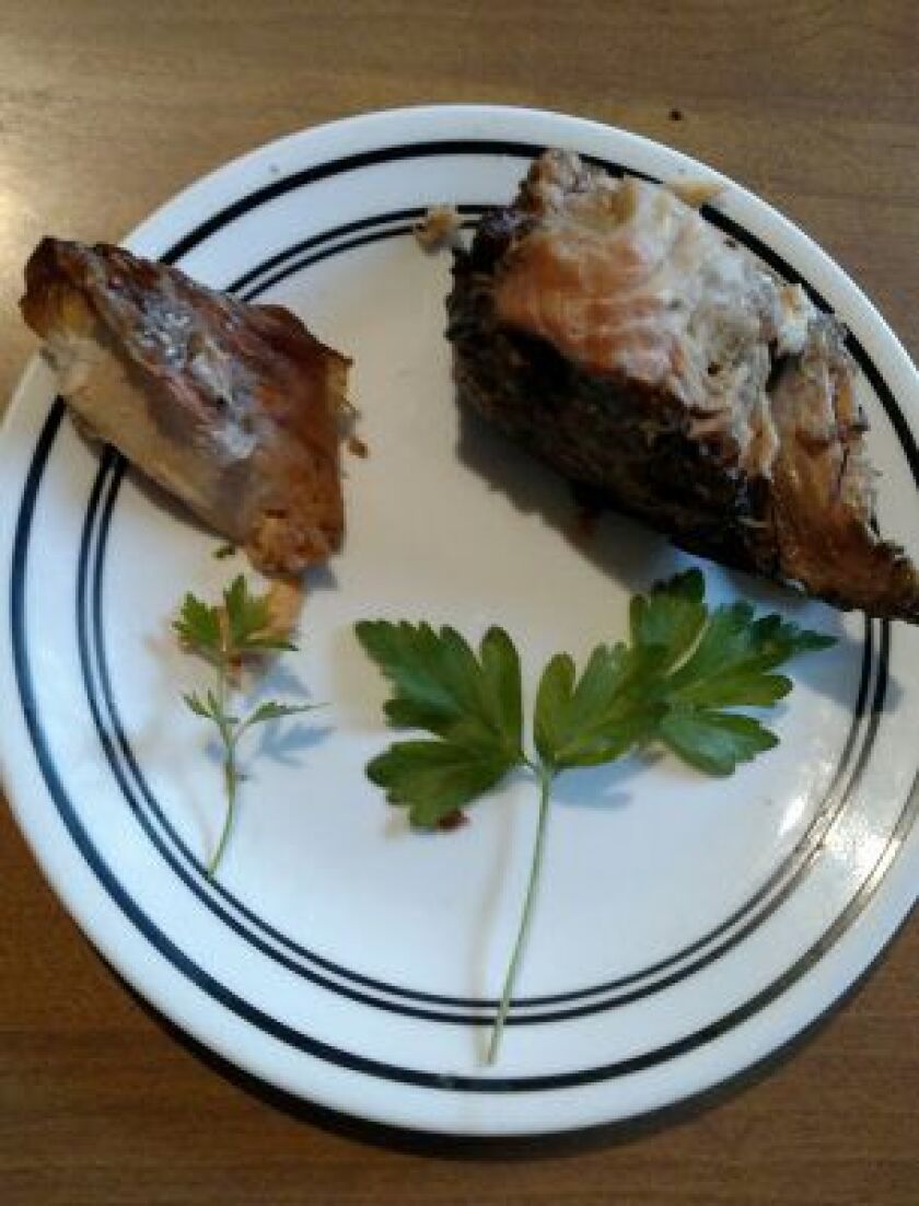 Smoked version, gussied up with fresh sprigs of home-grown parsley, of the big brown trout caught off Gary Light on April 21.<br>Dale Bowman/Sun-Times
