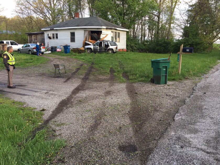 A witness said the car attempted to pass another vehicle in a no-passing zone at a high rate of speed, then swerved into a yard and struck a home on U.S. 35, north of LaPorte, Indiana. | LaPorte County Sheriff’s Dept.