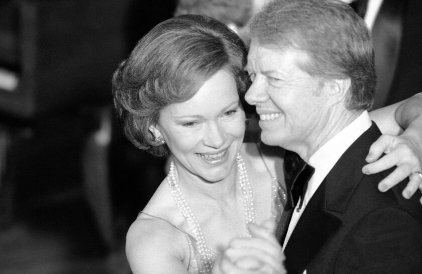 President Jimmy Carter and his wife Rosalynn at the Congressional Christmas Ball at the White House on Dec. 13, 1978.