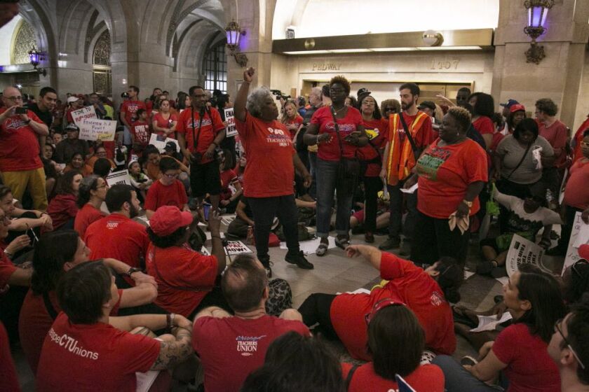 More than 100 members of the Chicago Teachers Union stage a sit-in at City Hall and rally for an elected representative school board and progressive revenue options to fund public schools, Wednesday, June 22, 2016.| Ashlee Rezin/Sun-Times