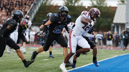 Brother Rice's Jahon Edwards (12) scores against Lincoln-Way East in the first half.