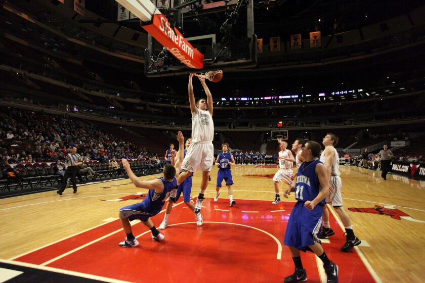 Kaneland big man Dave Dudzinski dunks against Geneva at the United Center.