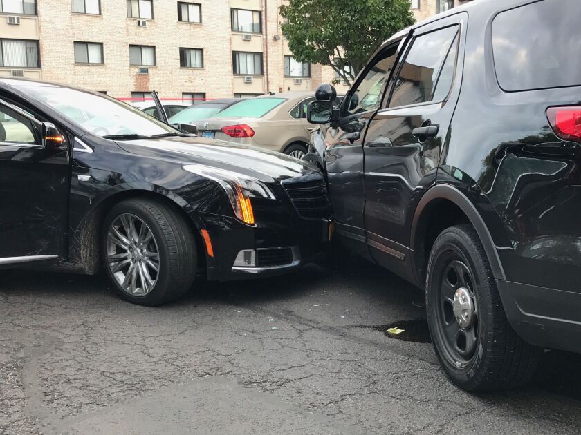 A photo released by Alsip police shows a Cadillac sedan crashed into a Alsip police squad car following a police-involved shooting early Wednesday in the Mount Greenwood neighborhood. | Alsip police