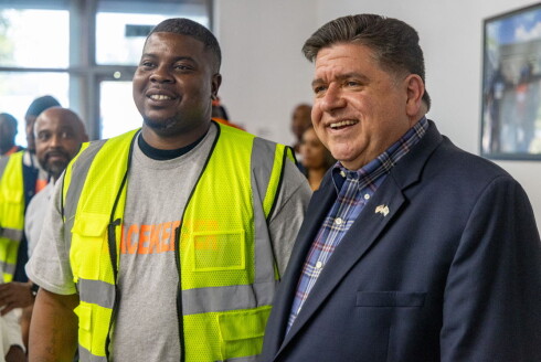 Kellen McMiller (left) poses with Gov. JB Pritzker at a Sept. 5 event.