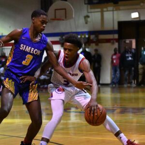 Simeon’s Antonio Reeves (3) reaches for a steal. Worsom Robinson/For the Sun-Times.