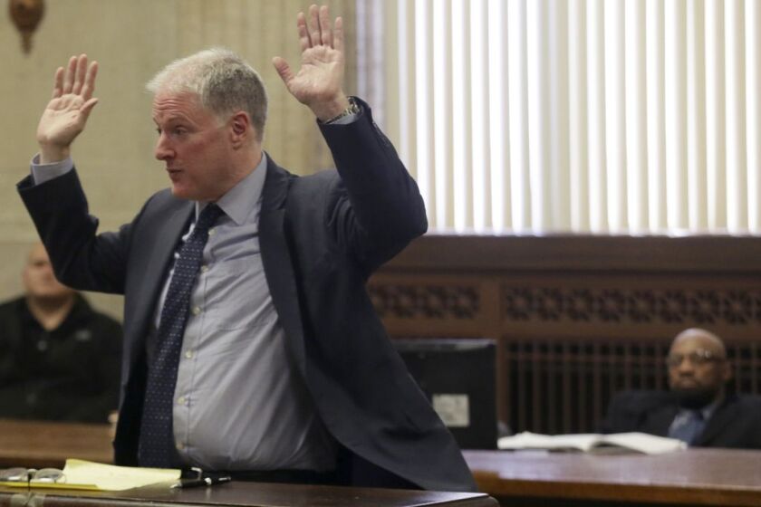 Attorney Scott Kamin speaks during opening statements in the trial of his client, Shomari Legghette, right, during Legghette’s murder trial.