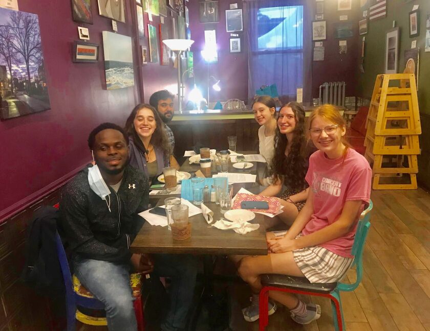 Mather High School senior Khan Ali, 19, of West Ridge, (left, rear), is among Illinois students who will take part in the global conversation on climate change at the 26th United Nations Climate Summit, which starts Sunday in Glasgow, Scotland. Also shown are (left, front to rear ) Kierre Turner, Lily Aaron and (right, front to rear) Charlotte Meyer, Jelena Collins and Sophie Ball.