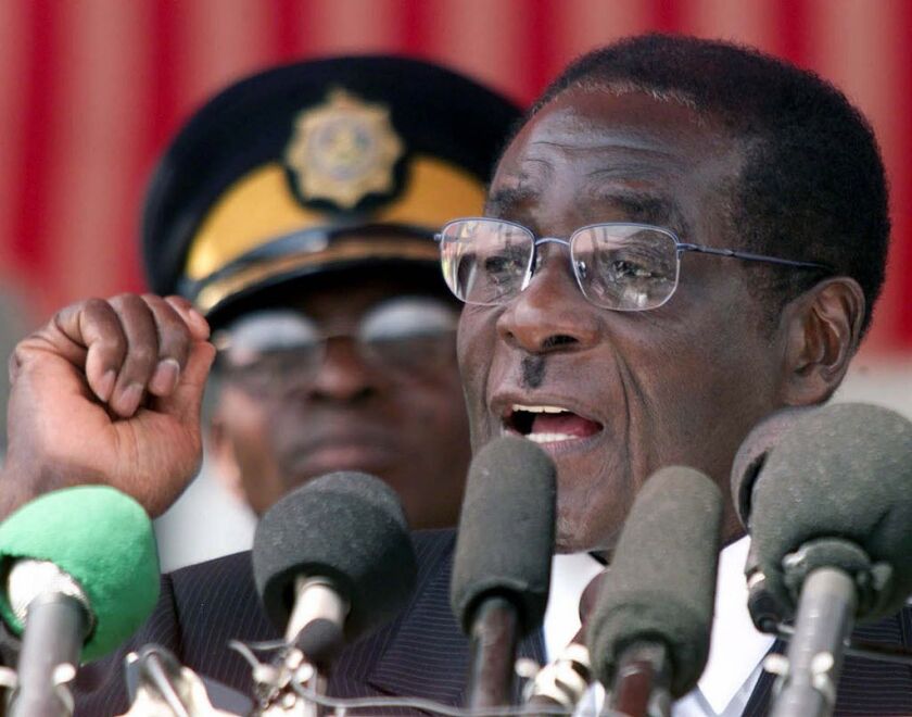 Zimbabwe President Robert Mugabe speaking during his annual Heroes Day address to the nation in, 2002. | AP
