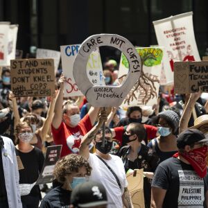 Chicago Teachers Union members and hundreds of supporters march through the Loop to call for the Chicago Board of Education to vote to end a $33 million contract between Chicago Public Schools and the Chicago Police Department, Wednesday afternoon, June 24, 2020.