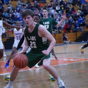 Lane’s Louis Perona (23) loses control of the ball against Proviso East, Wednesday 02-27-19. Worsom Robinson/For Sun-Times