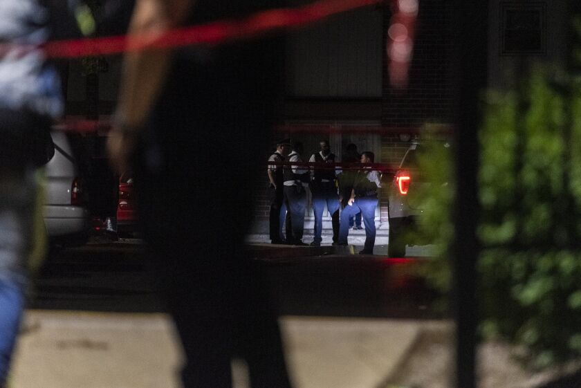 Chicago police investigate the scene where multiple people were shot, including a 9-year-old girl, June 17, 2020, in Gresham.