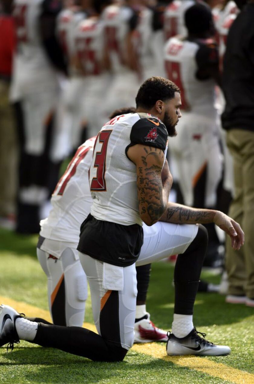 MINNEAPOLIS, MN – SEPTEMBER 24: Tampa Bay Buccaneers Wide Receivers Mike Evans #13, and DeSean Jackson #11, take a knee during the national anthem before the game against the Minnesota Vikings on September 24, 2017 at U.S. Bank Stadium in Minneapolis, Min