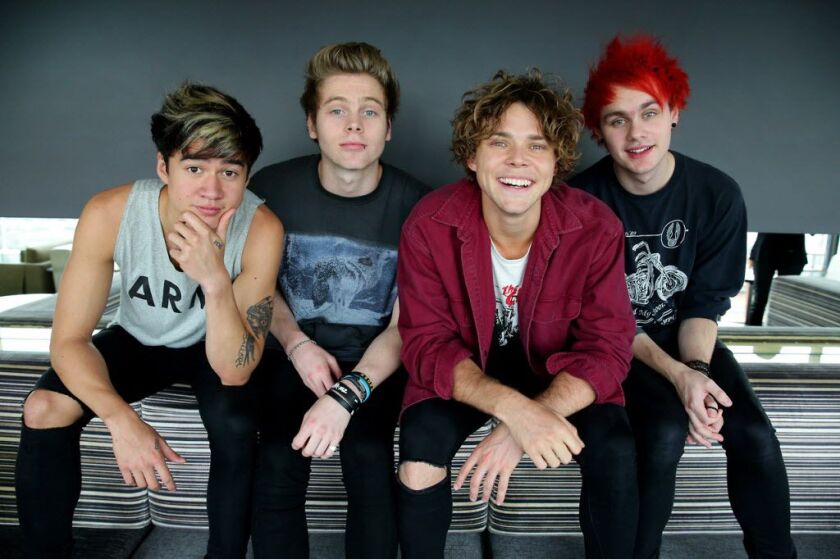 Left to right, Calum Hood, Luke Hemmings, Aston Irwin and Michael Clifford of Australian boy band 5 Seconds of Summer pose during a photo shoot at the Intercontinental Hotel in 2014 in Sydney, Australia. (Photo by Cameron Richardson/Newspix/Getty Images)