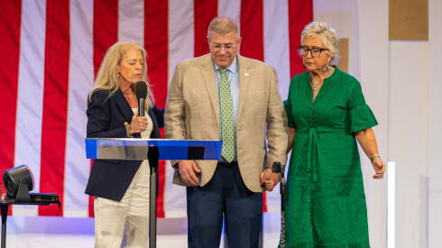 Darren Bailey, center, is shown at the Rockford Faith Center alongside his wife, at right, and Pastor Marla Lyon Eash, at left.