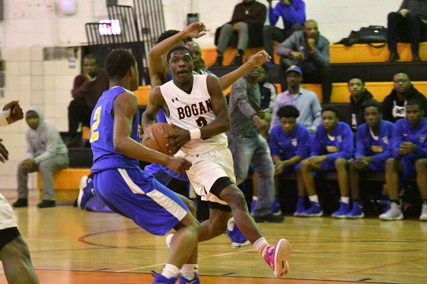 Bogan’s Jeremiah Washington (3) drives to the basket. Worsom Robinson/For the Sun-Times.