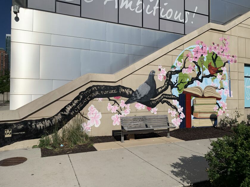 Sergio Maciel's mural “Knowledge” at 161 W. Ninth St., created in June.