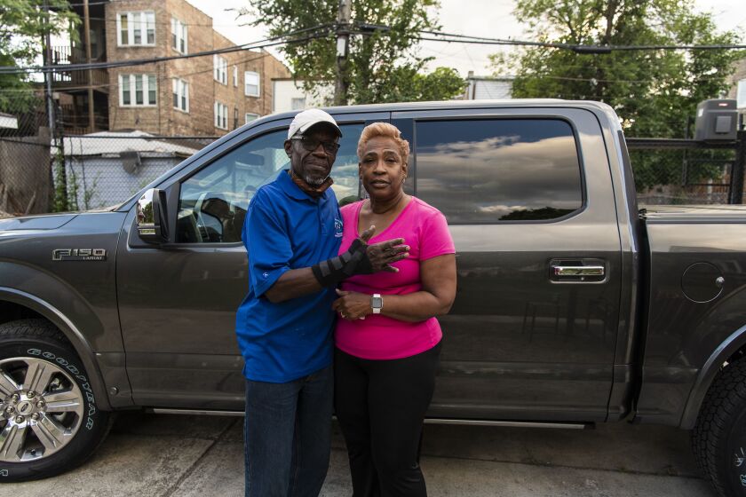 Arthur Turner Sr., left, a former member of the Illinois House of Representatives on Tuesday stands next to his wife, Rosalyn, and the new truck he was going to buy when he was arrested over the weekend.