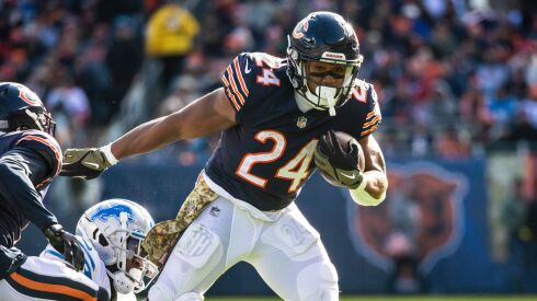Chicago Bears running back Khalil Herbert runs the ball during the second quarter against the Detroit Lions on Sunday.