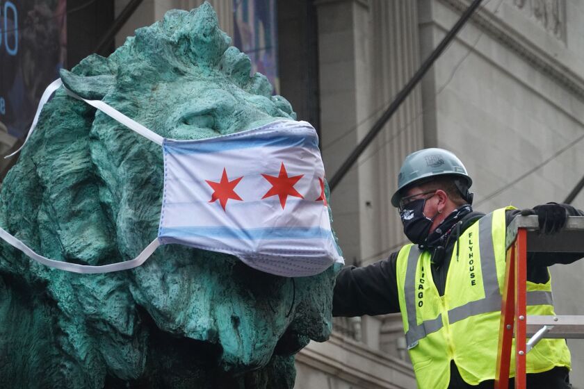 Masks Placed On Chicago Landmarks Before New Law Mandating Face Coverings Takes Effect