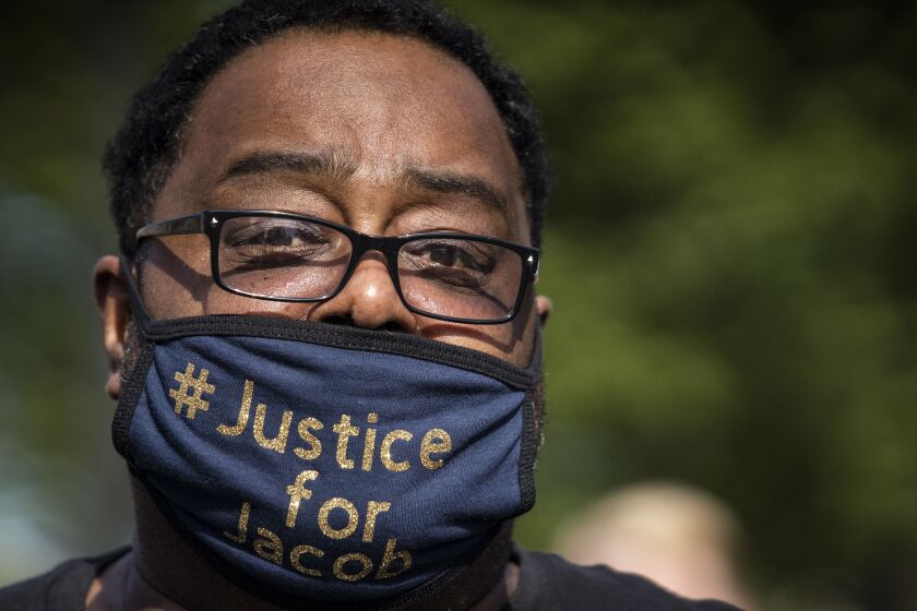 Jacob Blake’s father, also Jacob Blake, speaks to a crowd of more than a thousand during a rally in Civic Center Park in downtown Kenosha, six days after his son was shot in the back by a police officer in the Wisconsin city, Saturday, Aug. 29, 2020.