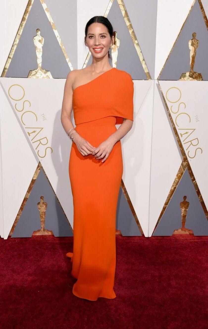 Olivia Munn wears a Stella McCartney tangerine gown. |Photo by Dan Steinberg/Invision/AP