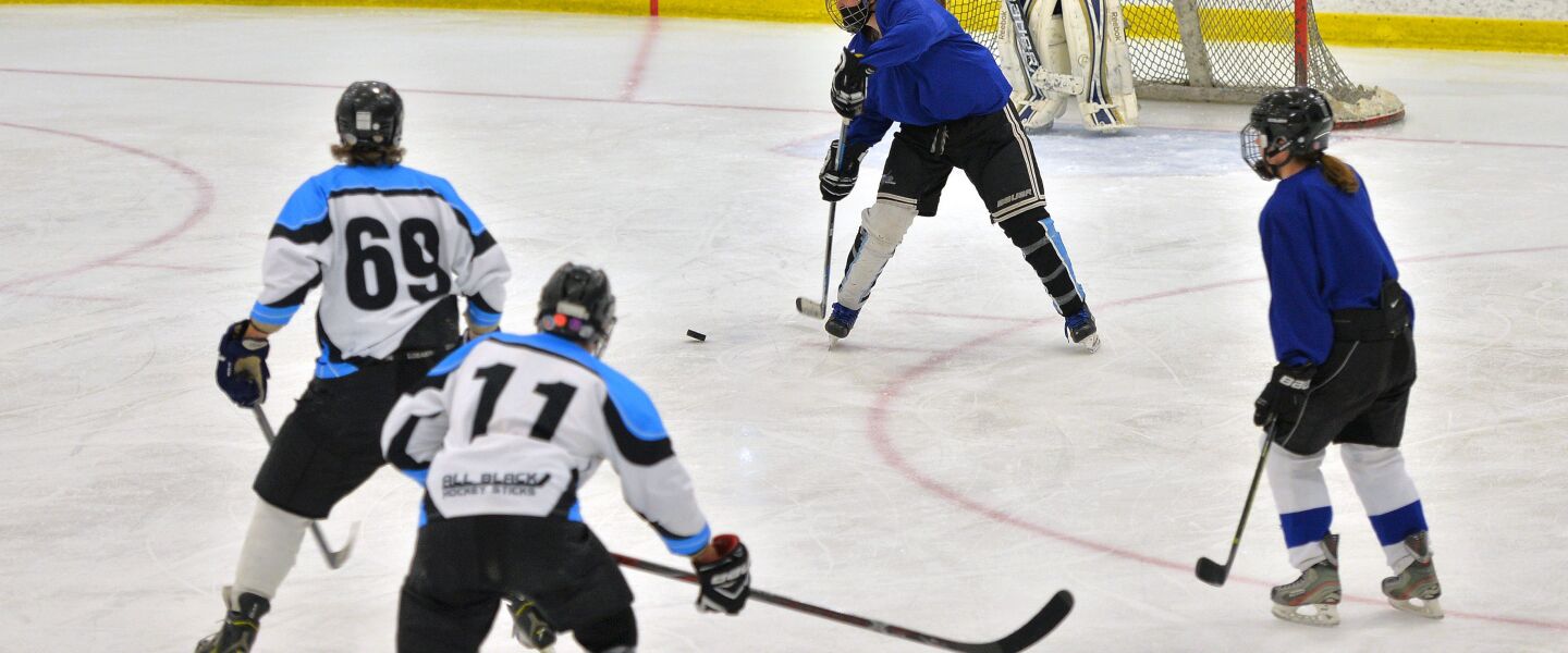 The Chicago North Stars (in blue jerseys) practice with a men’s team at Johnny’s IceHouse West.