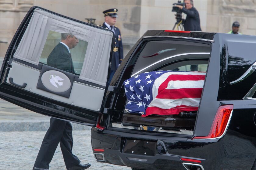 The casket of Senator John McCain arrives at the Washington National Cathedral in Washington, DC. | Getty Images