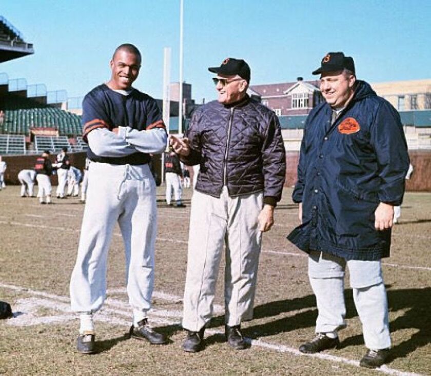 Abe Gibron (right) with George Halas and Gale Sayers at Wrigley Field. (Getty Images)